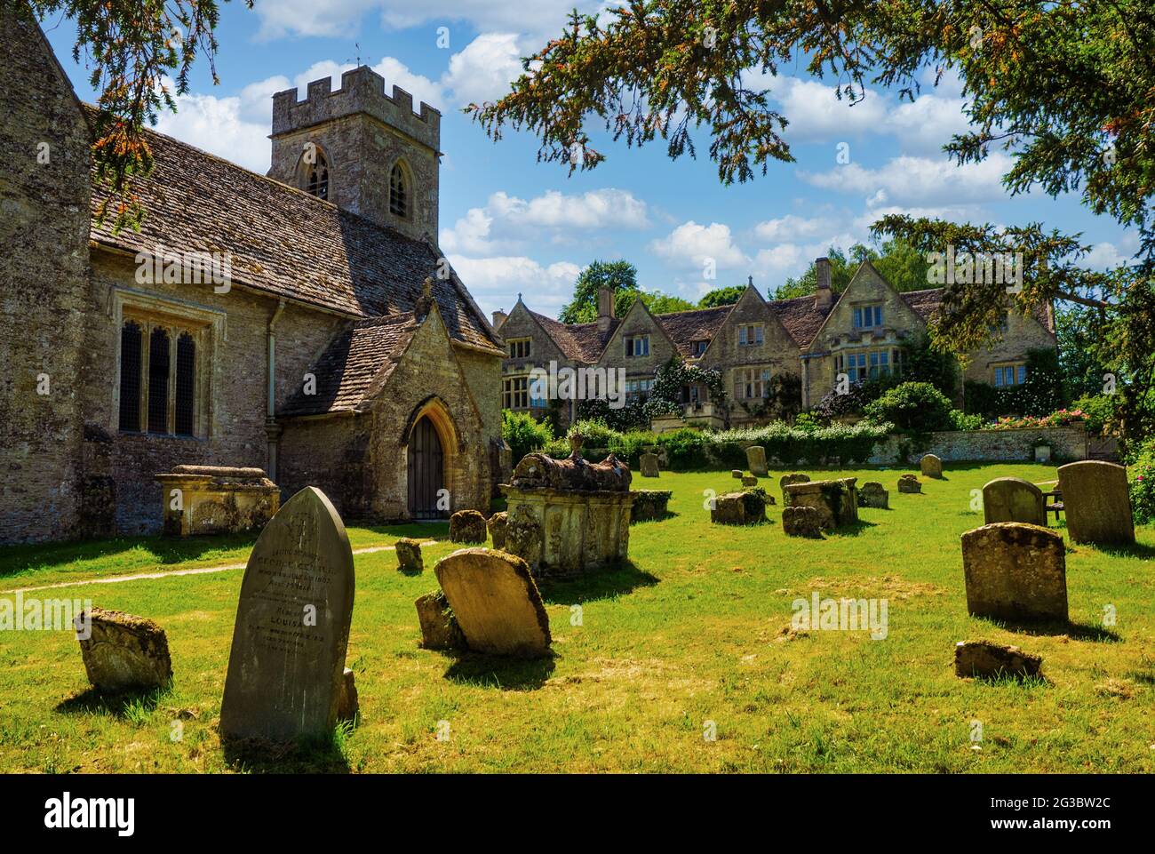 Asthall Manor is a Jacobean manor house in the Windrush Valley of Oxfordshire. It lies next to St Nicholas church in the village of Asthall. Stock Photo