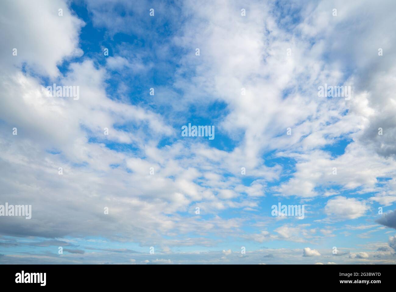 Beautiful bright blue sky with fluffy clouds Stock Photo - Alamy