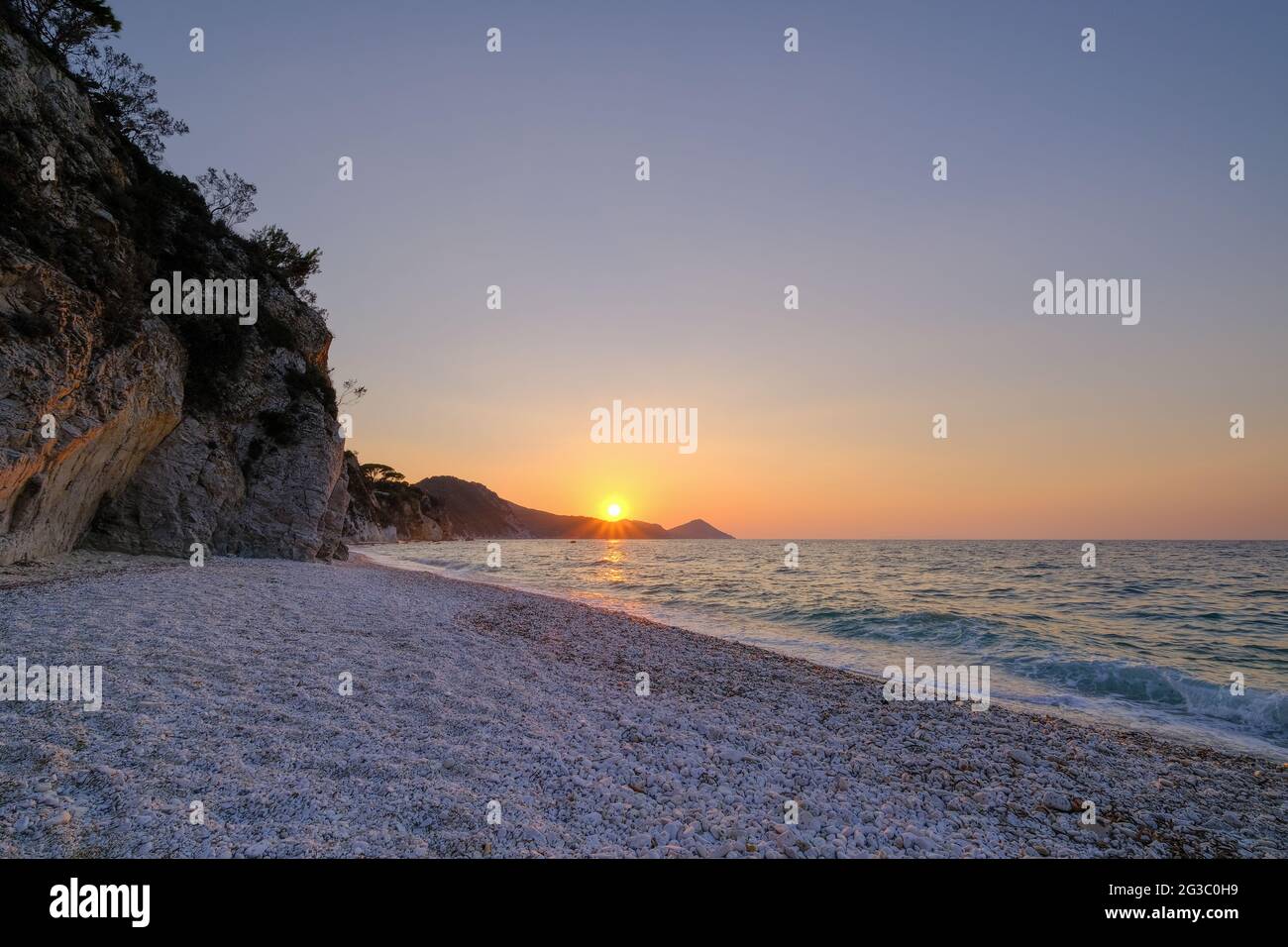sunset on a beach in italy Stock Photo