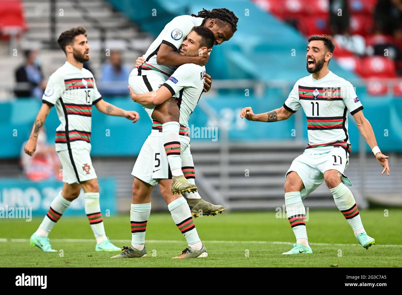 15 June 2021, Hungary, Budapest: CORRECTING PLAYERS NAME - Football: European Championship, Hungary - Portugal, preliminary round, Group F, Matchday 1 at Puskás Arena. Portugal's Rafa Silva (l-r), Portugals Renato Sanches, Portugal's Raphael Guerreiro and Portugal's Bruno Fernandes celebrate the 0:1 goal. Important: For editorial news reporting purposes only. Not used for commercial or marketing purposes without prior written approval of UEFA. Images must appear as still images and must not emulate match action video footage. Photographs published in online publications (whether via the Intern Stock Photo