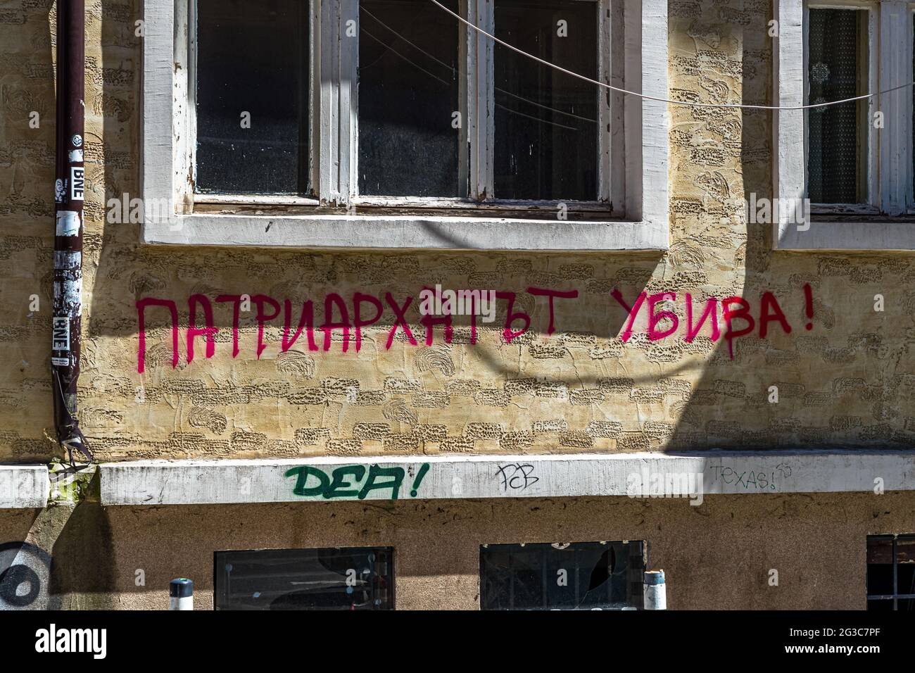 Slogan sprayed on the wall in Sofia, Bulgaria: Patriarchy kills Stock Photo