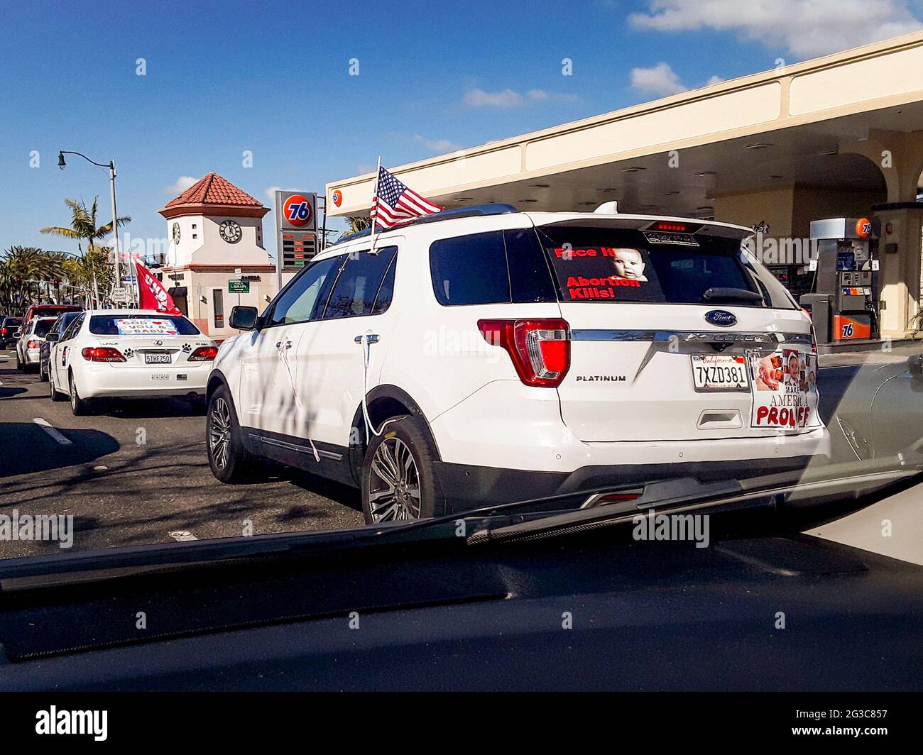 Cars bearing anti abortion slogans drive to a rally in Newport Beach, CA. Stock Photo