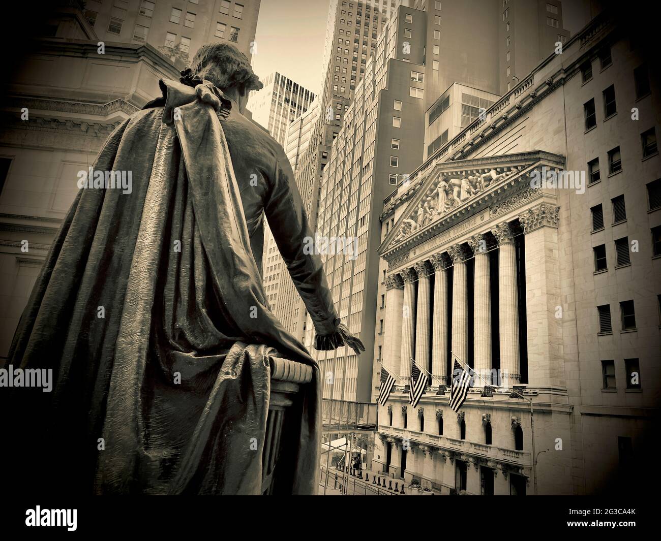 Statue of George Washington at Federal Hall & New York Stock Exchange building facade in the background. Stock Photo