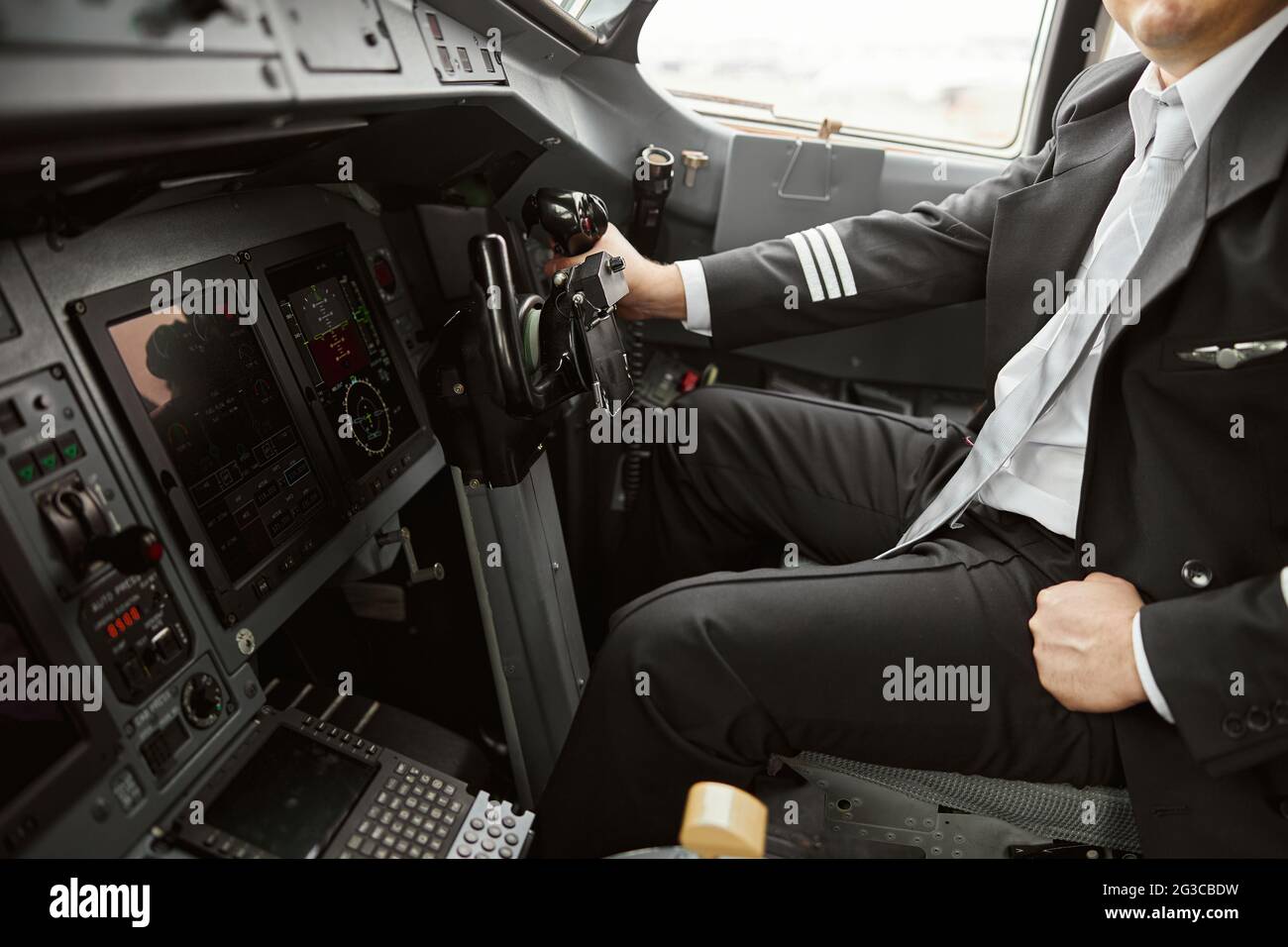 Male pilot use steering wheel to fly on airplane Stock Photo Alamy