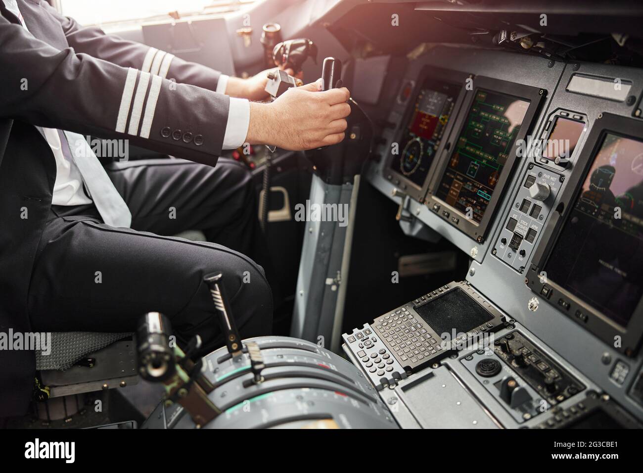 Male pilot use steering wheel to fly on airplane Stock Photo Alamy