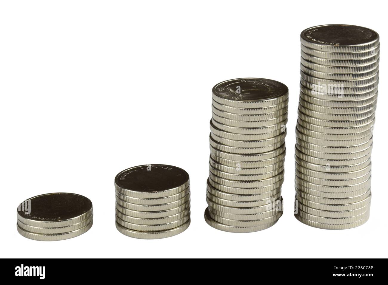 Four stacks of different sizes of iron silver coins on a white