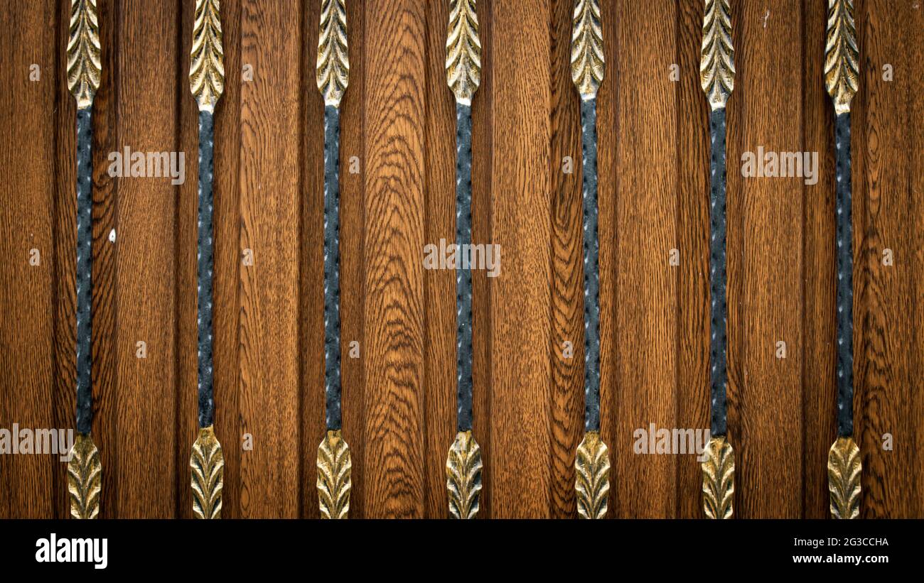 Forged metal pattern on a wooden surface. Texture or background Stock ...