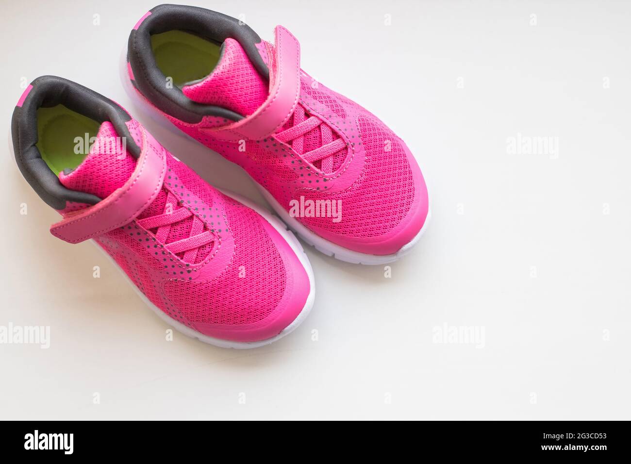 modern pinky sport shoes on white background Stock Photo - Alamy