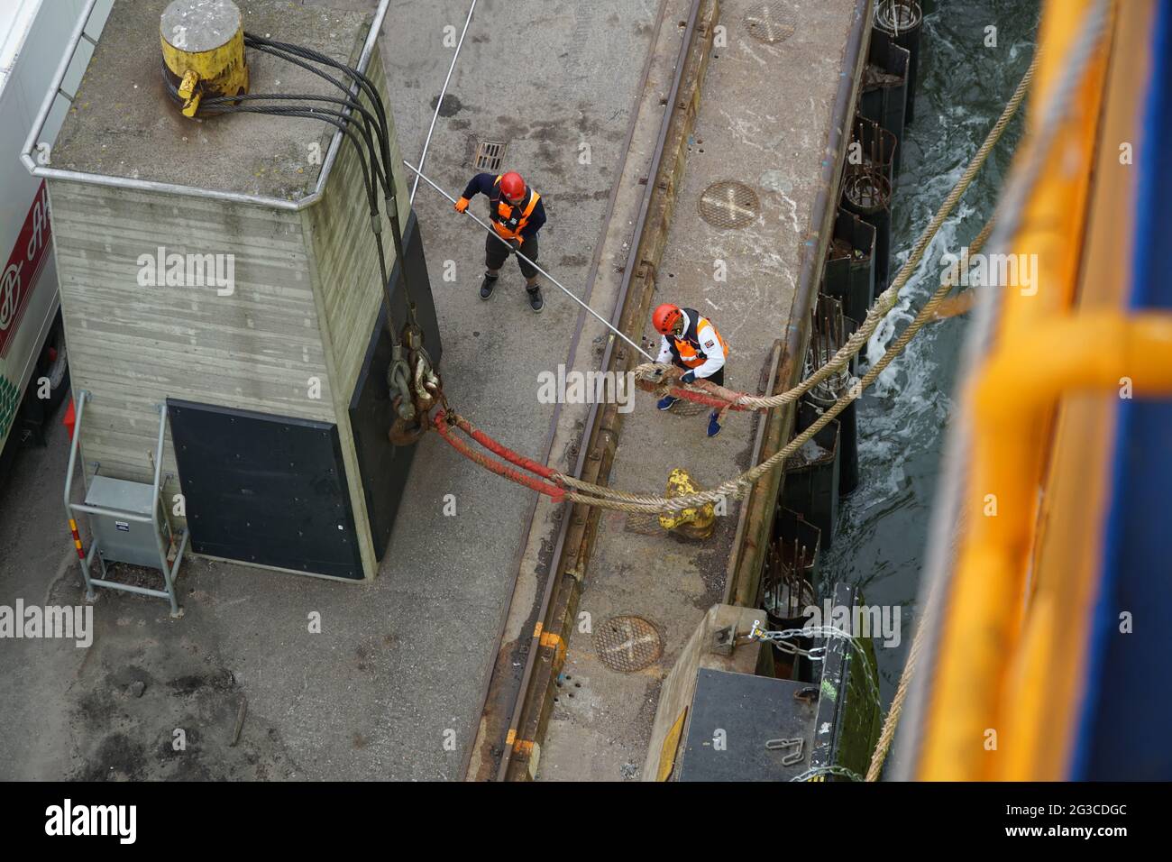 Port crew mooring Ship at the quay at Helsinki Port on Baltic Sea, Europe. Stock Photo