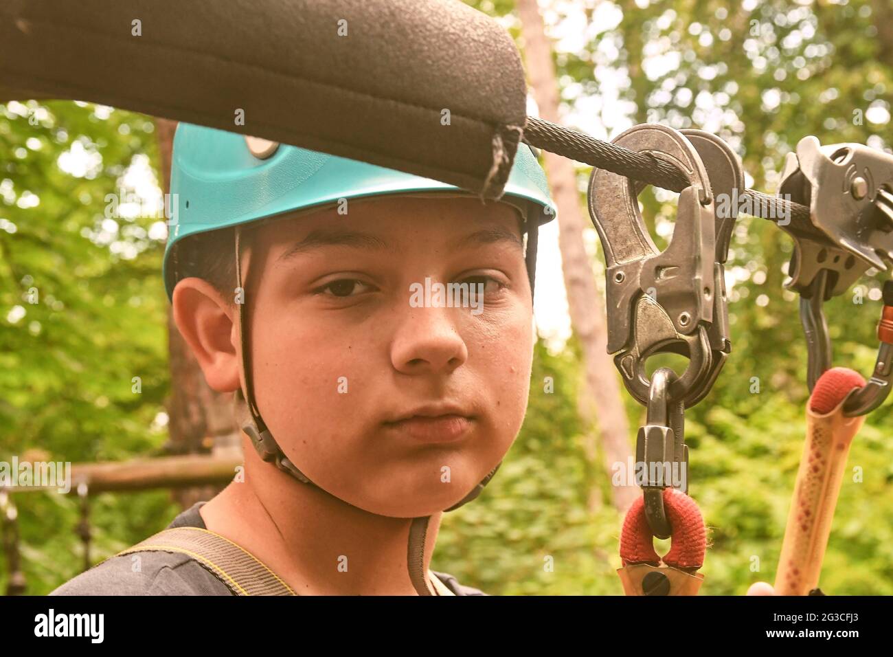 Boy in a rope center. Agility skills and climbing outdoor amusement