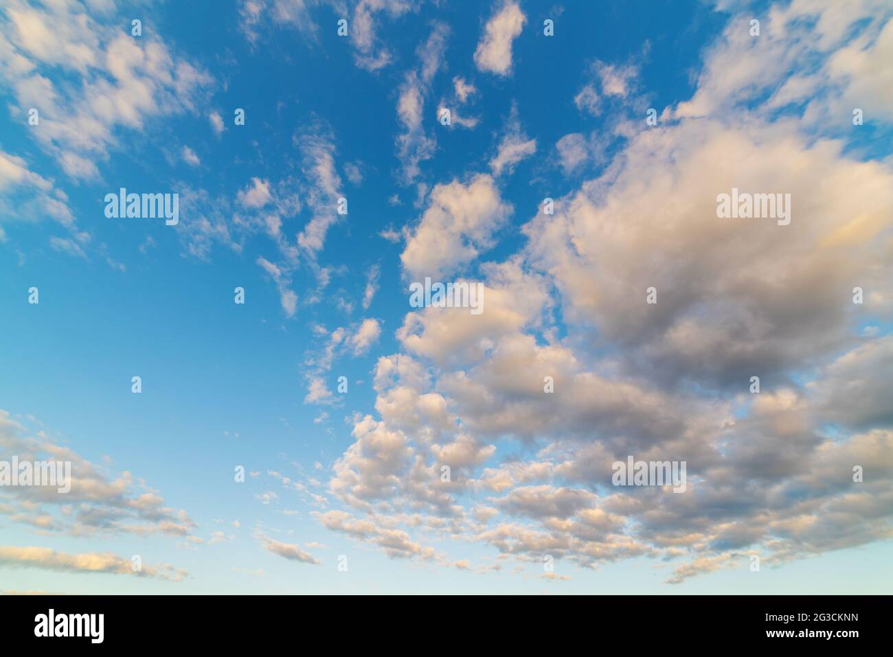 Beautiful bright blue sky with fluffy clouds Stock Photo - Alamy