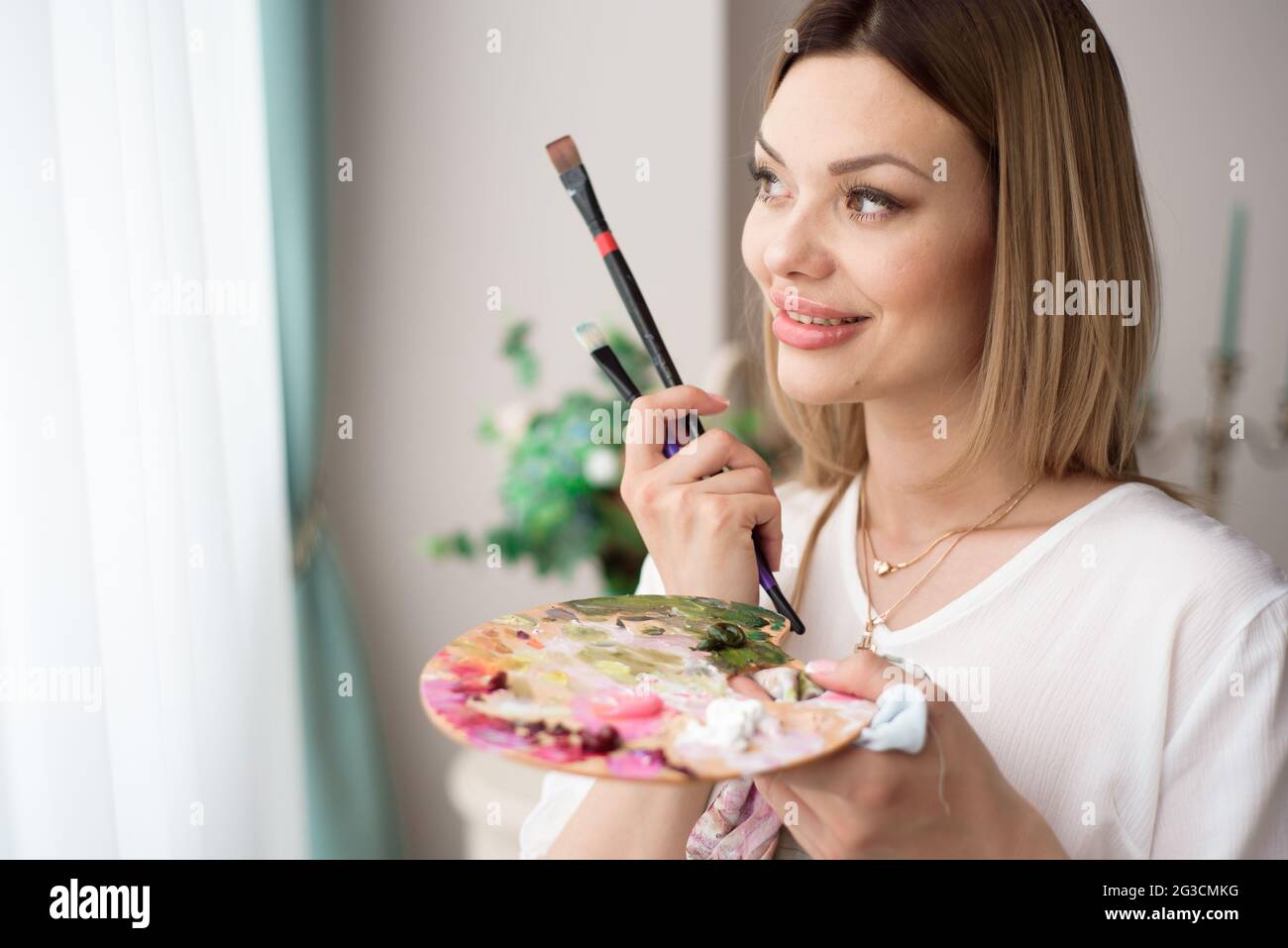 Art, creativity, job and creative occupation concept. Female artist