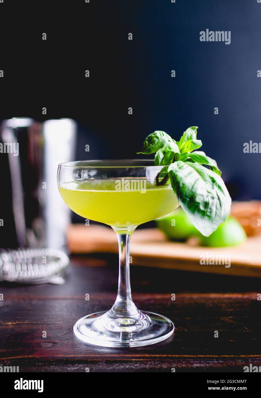 Thai Basil Gimlet Cocktail with Garnish A gin cocktail in a coupe