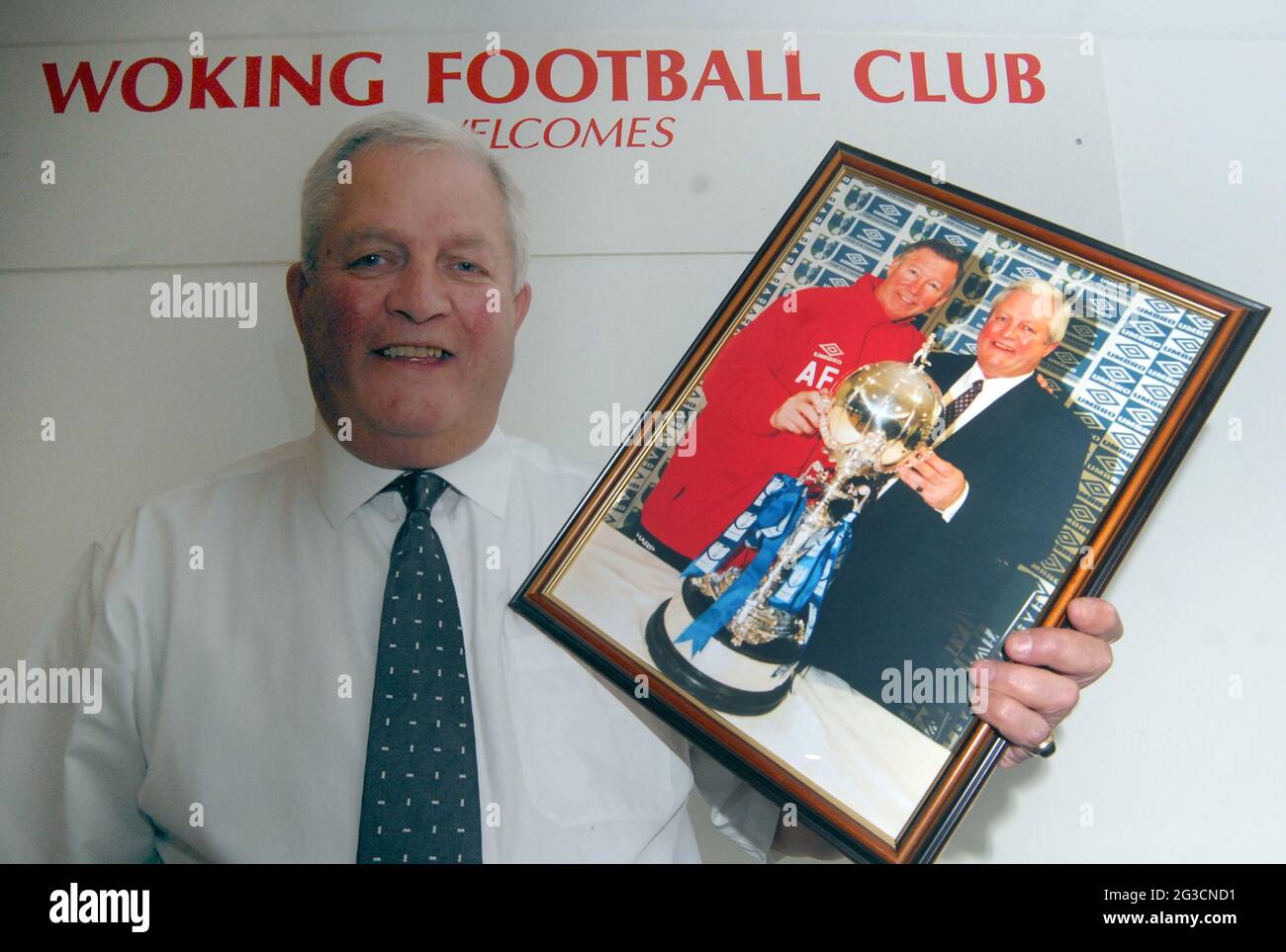 Geoff Chapple, commercial manager of Woking who face Swindon in the FA Cup this weekend, pictured with Sir Alex Ferguson. after winning the FA Trophy with Kingstonians Geoff is the most successful manager in non-league history having made the First Round 12 times and knocked out seven league clubs. Pic Mike Walker, 2009 Stock Photo