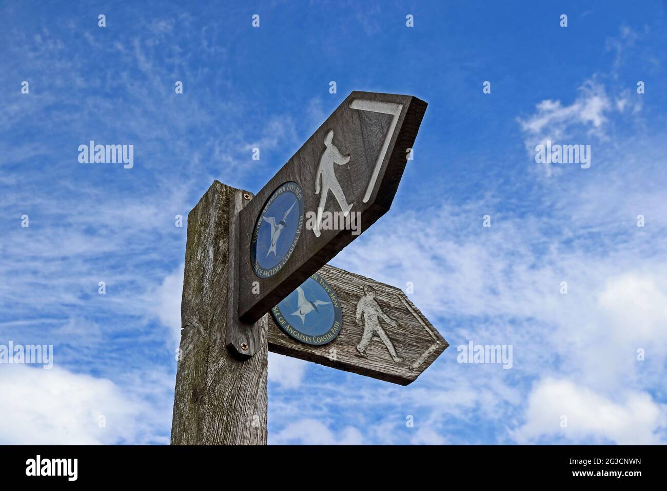 Wooden signpost showing Isle of Anglesey Coastal Path, Beaumaris Stock Photo