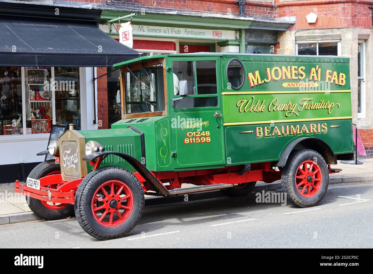 M Jones ai fab, antique dealers van parked outside shop, Beaumaris Stock Photo