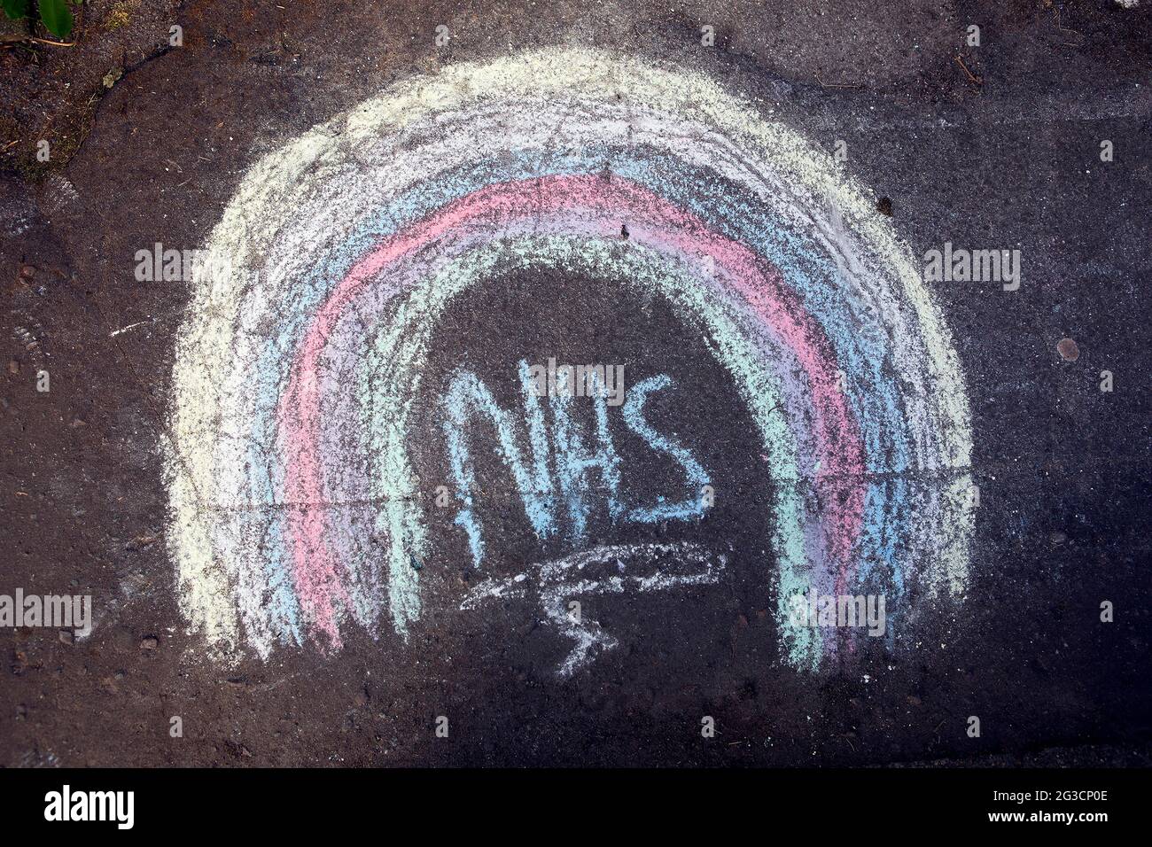 A child’s chalk drawing on the pavement outside a house in Hebden Bridge, west Yorkshire showing support for the NHS as the coronavirus pandemic conti Stock Photo