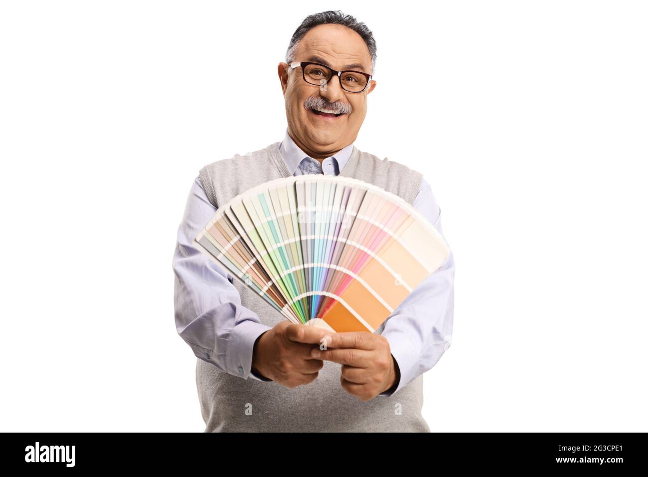 Mature man holding a color palette and looking at the camera isolated on white background Stock Photo