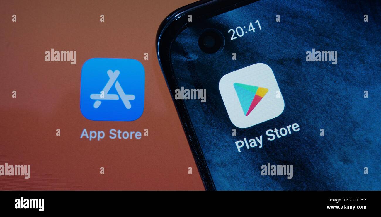 Google Play Store and blurred App Store apps seen on android smartphone and Apple  macbook M1 laptop screens. Concept. Stafford, UK, June 15, 2021 Stock Photo  - Alamy