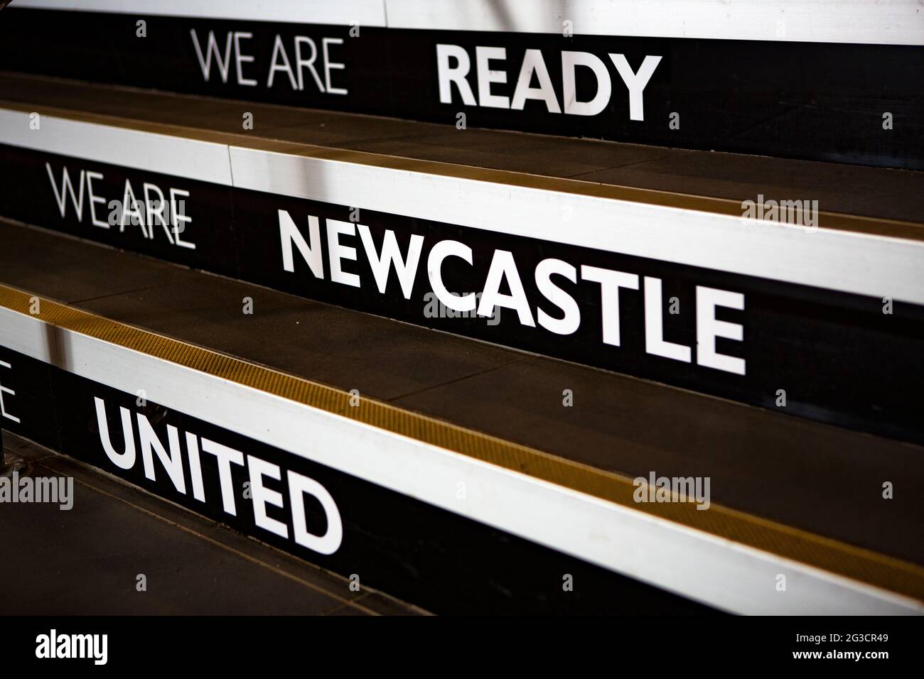 Words on a staircase which leads to the players and official entrance at  Newcastle United’s football stadium and home ground St James’ Park. Stock Photo