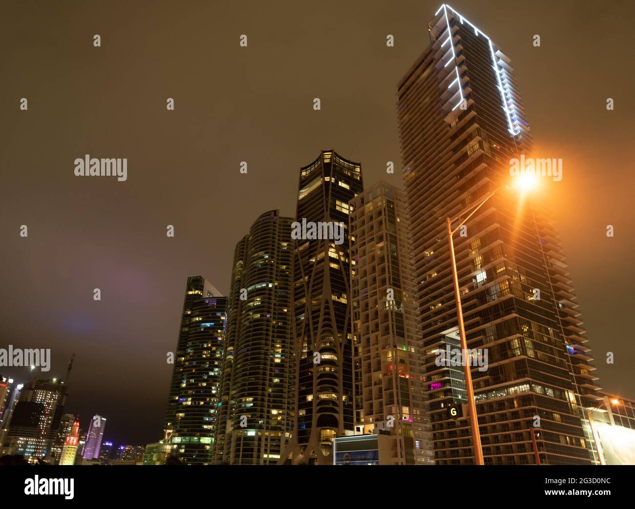 Towerblocks lit up in night city of Miami, USA Stock Photo