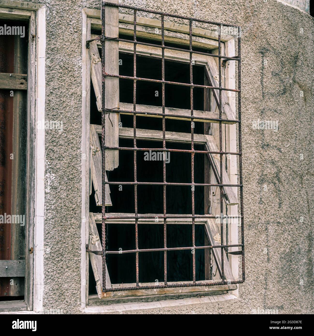 Old window without glass with a metallic grid Stock Photo Alamy