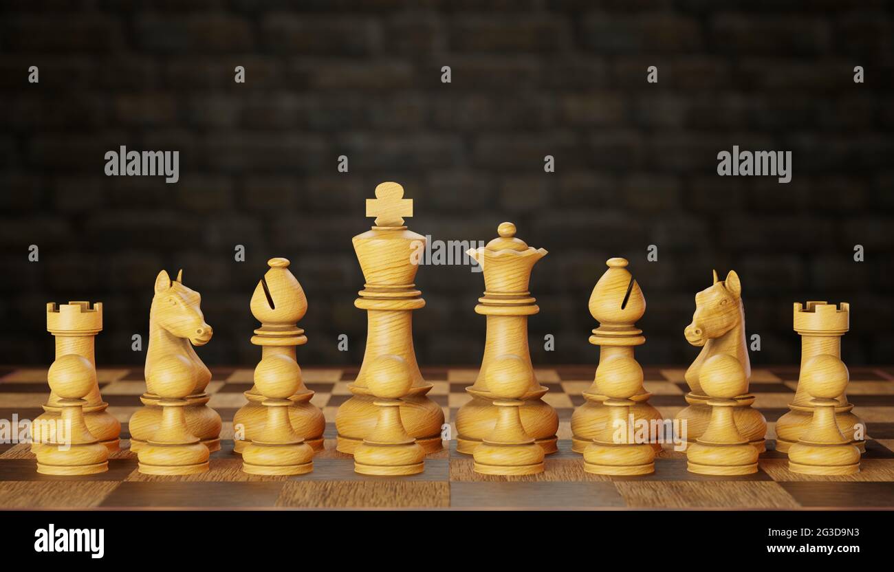 A set of bright wooden chess pieces placed on a chessboard in a brick wall background. The concept of business strategy planning. Copy space for text Stock Photo