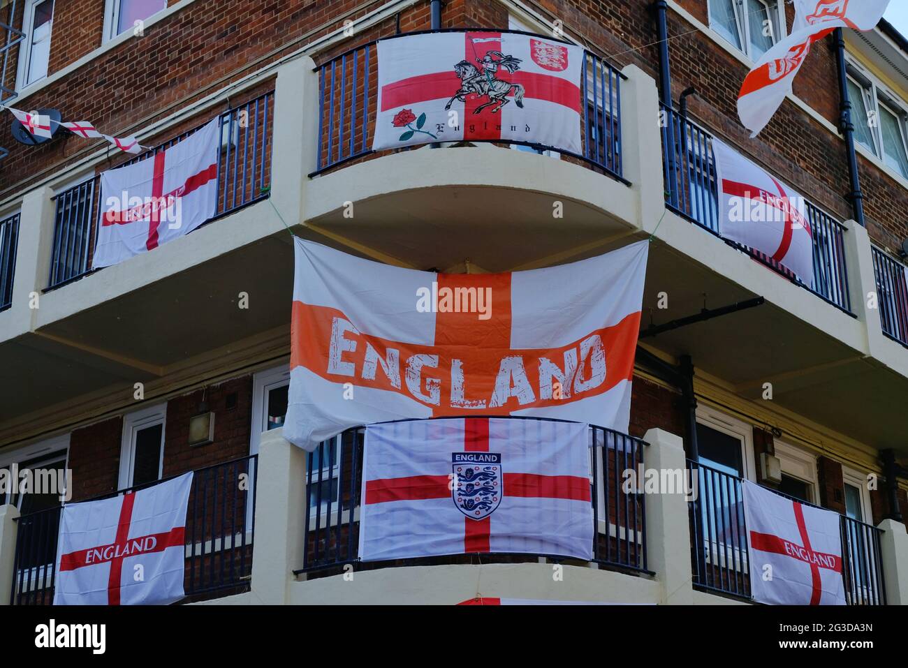 London, UK. Over 400 St George's flags line the balconies on Kirby Estate where residents decorated buildings in advance of the Euro 2020 tournament Stock Photo