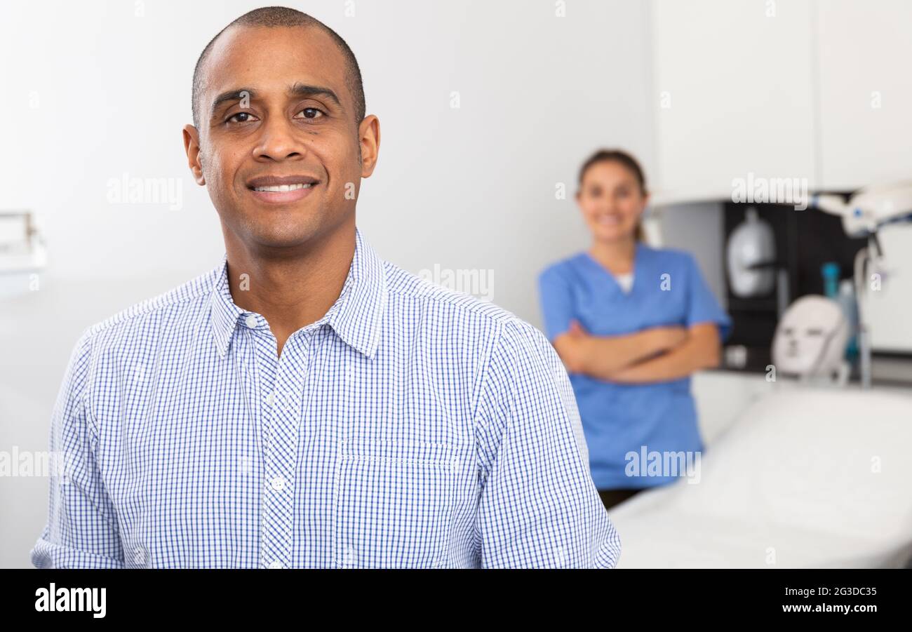 Smiling male client after professional esthetician procedures Stock Photo