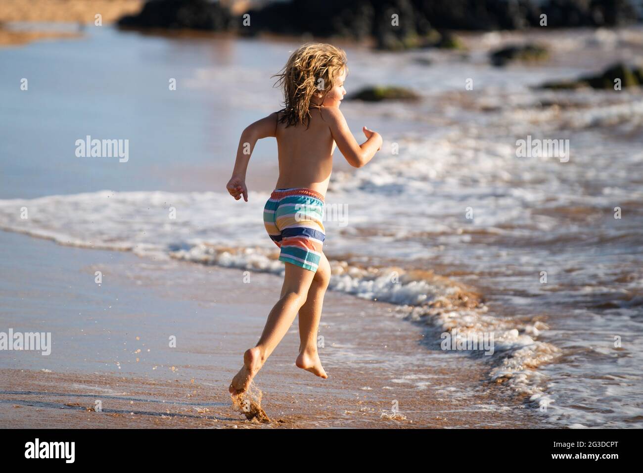 Child Running Through Water Close To Shore Along The Sea Beach A Boy Runs Along The Sea Coast Rest Of Children On Summer Vacation Stock Photo Alamy