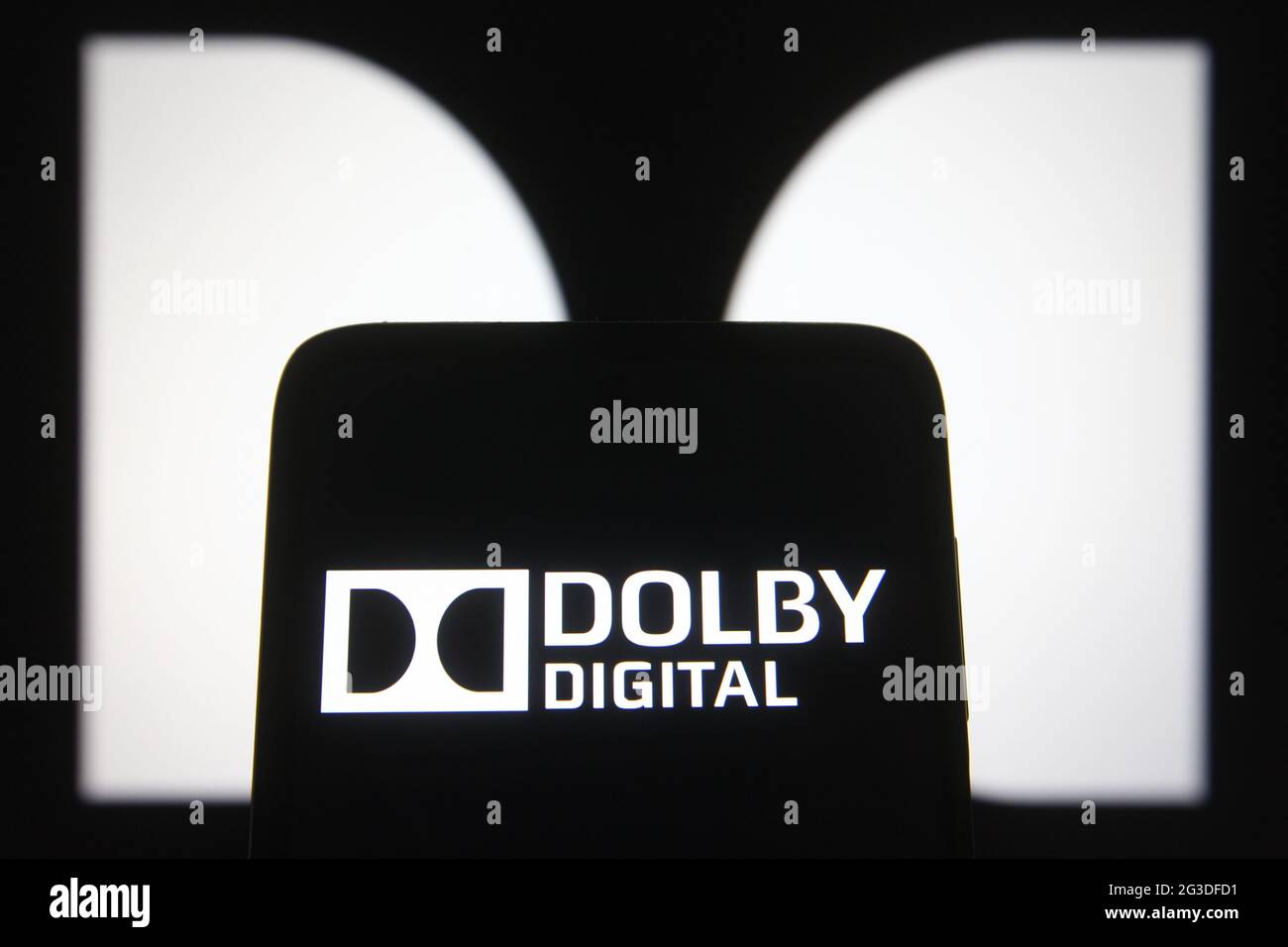 Ukraine. 15th June, 2021. In this photo illustration, the Dolby Digital logo seen on a smartphone screen and in the background. Credit: SOPA Images Limited/Alamy Live News Stock Photo