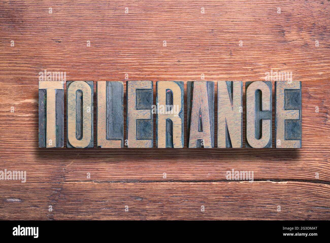 tolerance word combined on vintage varnished wooden surface Stock Photo