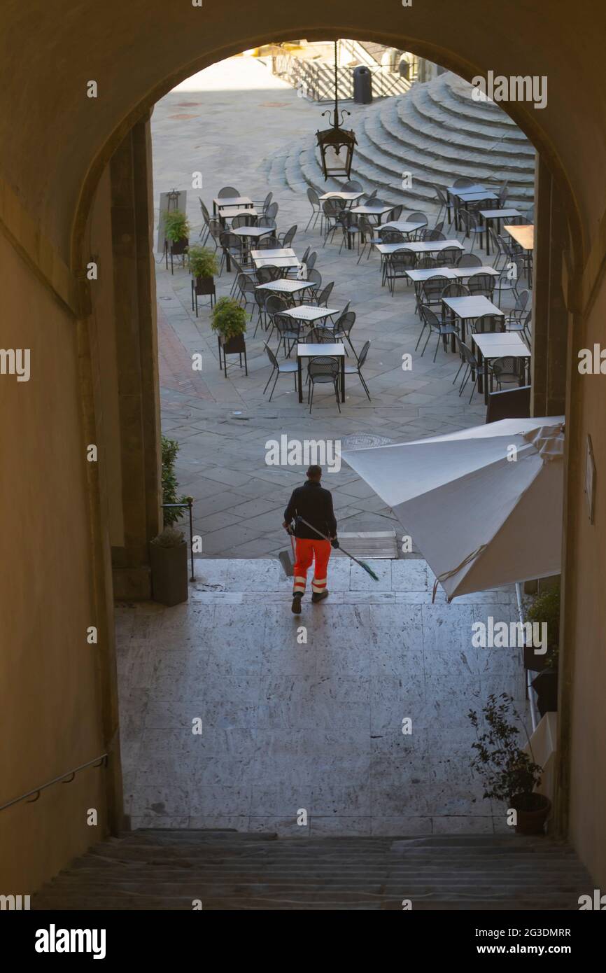 Garbage man standing with broom in a famous square in the old town ...