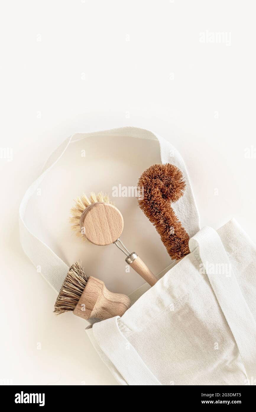 Zero waste kitchen cleaning concept. Eco friendly natural cleaning tools and products, bamboo dish brushes. No plastic, eco-friendly lifestyle. Top view, flat lay. Stock Photo