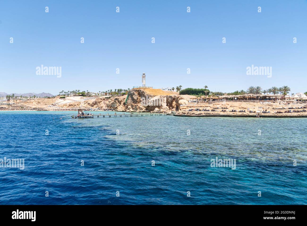 Beautiful rocky coast in the resort town of Sharm el Sheikh, Egypt. View from the sea. Egyptian landscape in Sinai. Stock Photo