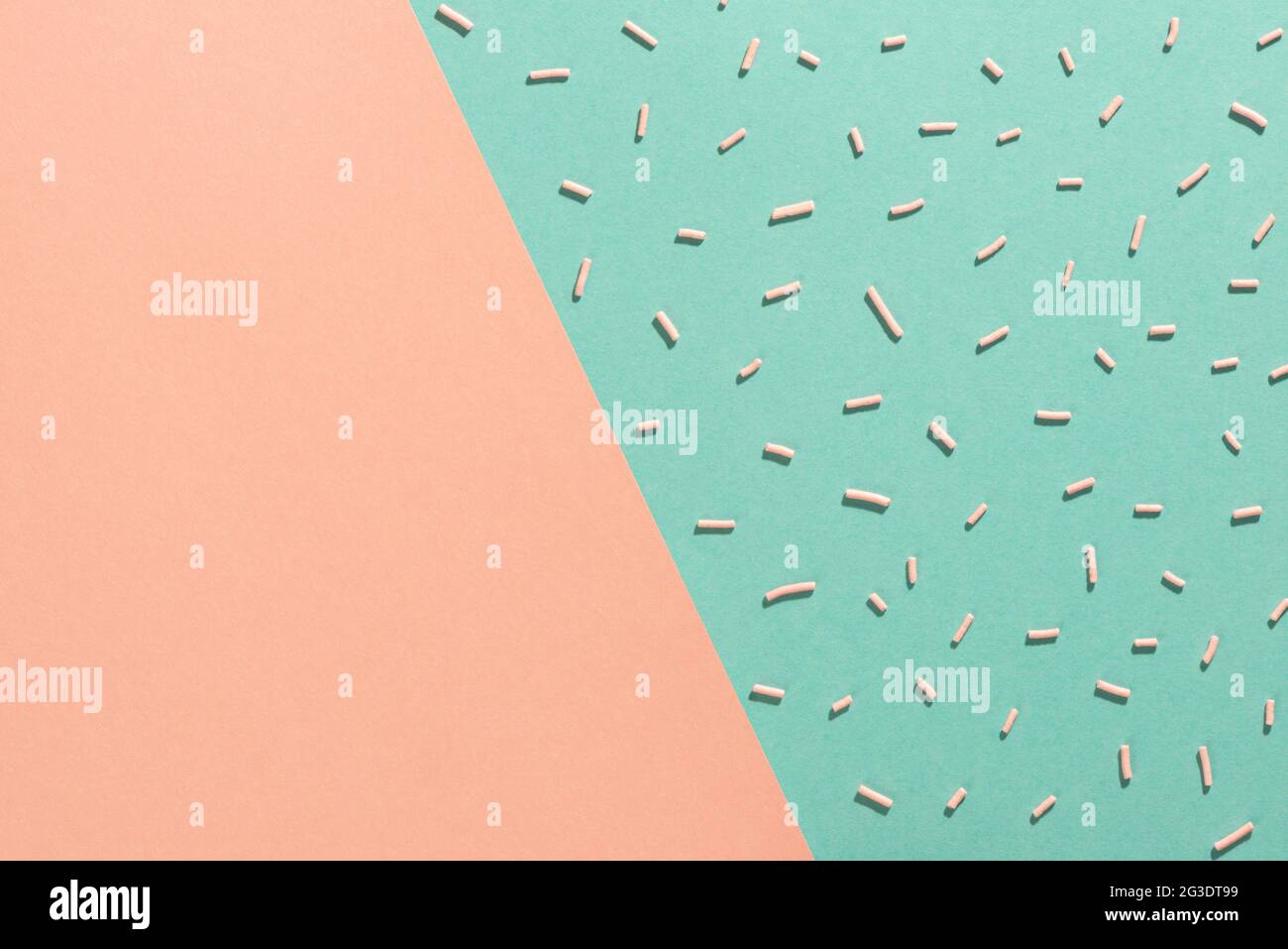 trendy pattern of colorful sprinkles for background of design banner, poster, flyer, card over pink and blue, minimal summer concept Stock Photo