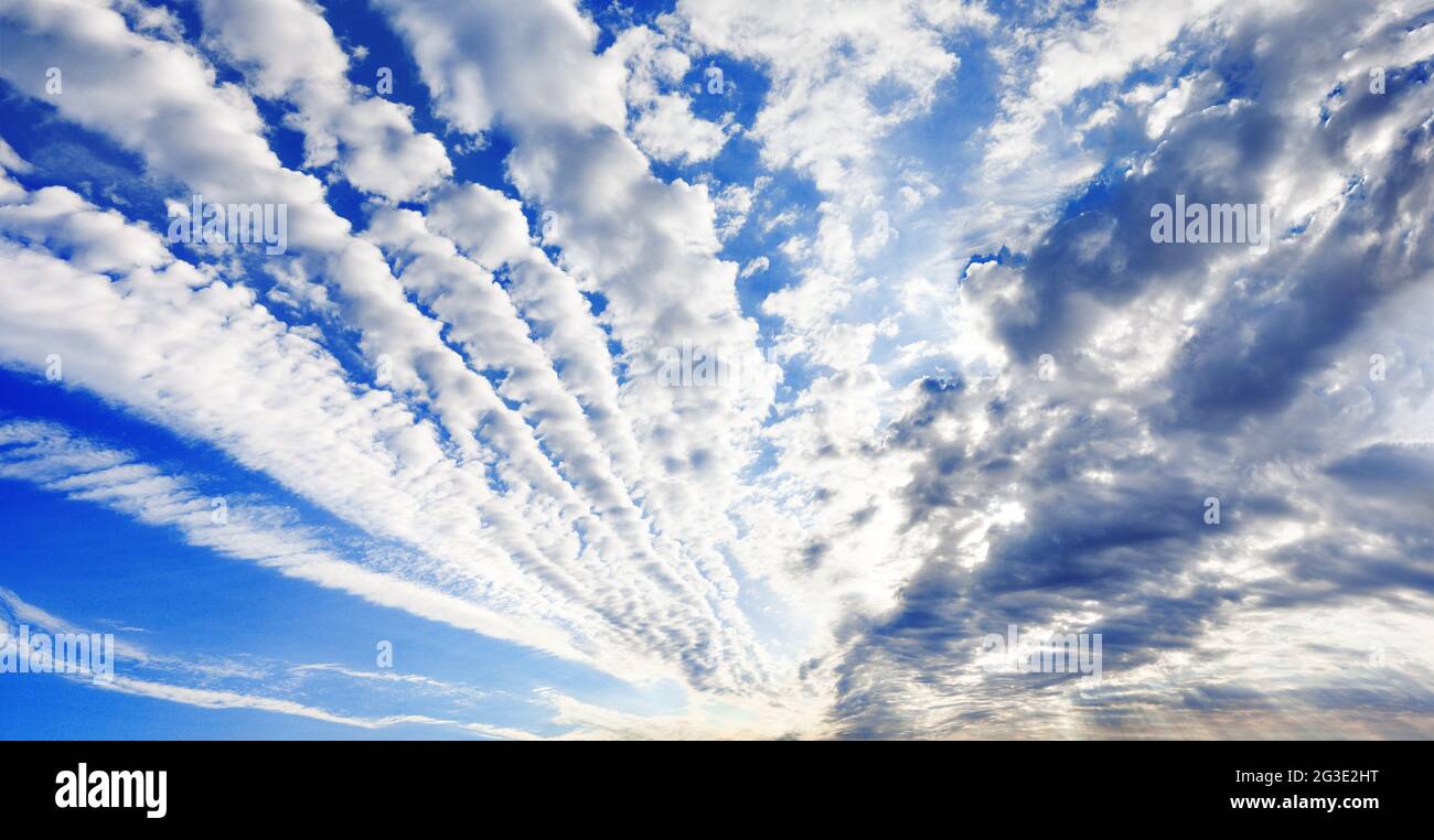 White cirrocumulus clouds blue sky background panorama, altocumulus cloudy skies, stratocumulus cloud texture, cirrus cumulus cloudscape, cloudiness Stock Photo