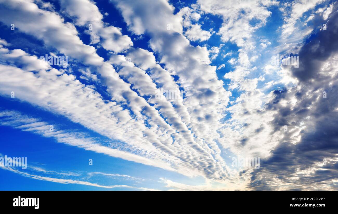 White cirrocumulus clouds blue sky background panorama, altocumulus cloudy skies, stratocumulus cloud texture, cirrus cumulus cloudscape, cloudiness Stock Photo