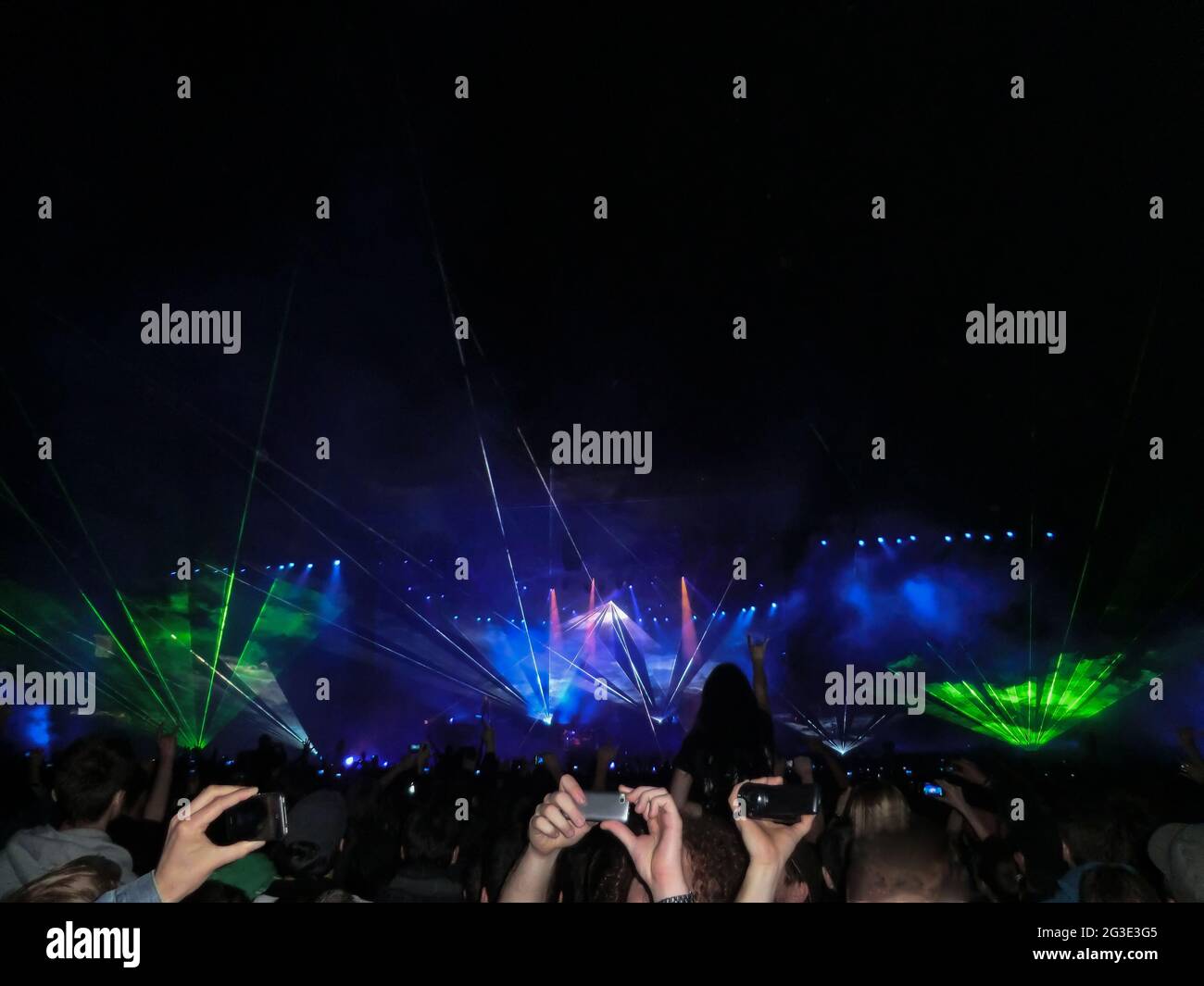 An evening rock concert in front of a large audience at an openair