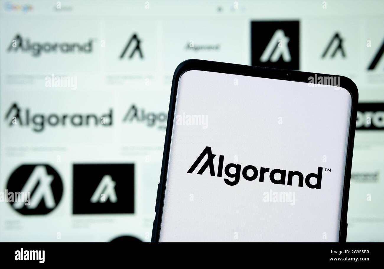 Algorand cryptocurrency platform logo seen on smartphone and blurred  Algorand logos on blurred laptop. Concept. Stafford, United Kingdom, June 16, 20 Stock Photo