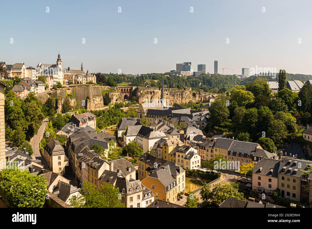 View from the Luxembourg city wall to the lower situated district Grund at the Alzette river. In the background the modern skyline on the Kirchberg Plateau Stock Photo