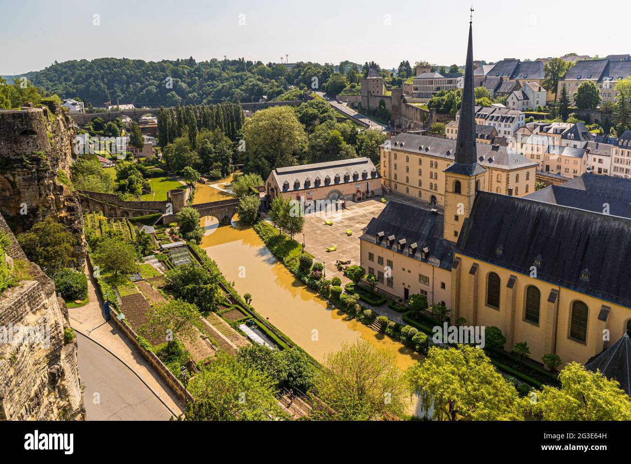 Casemates du Bock in Luxembourg. Neumünster Abbey on the banks of the Alzette River in the Grund district. In the courtyard modern seating sculptures. On the terraces along the old fortification wall is also grown wine Stock Photo