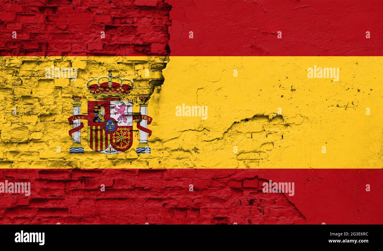 Spain flag is painted onto an old brick wall Stock Photo - Alamy
