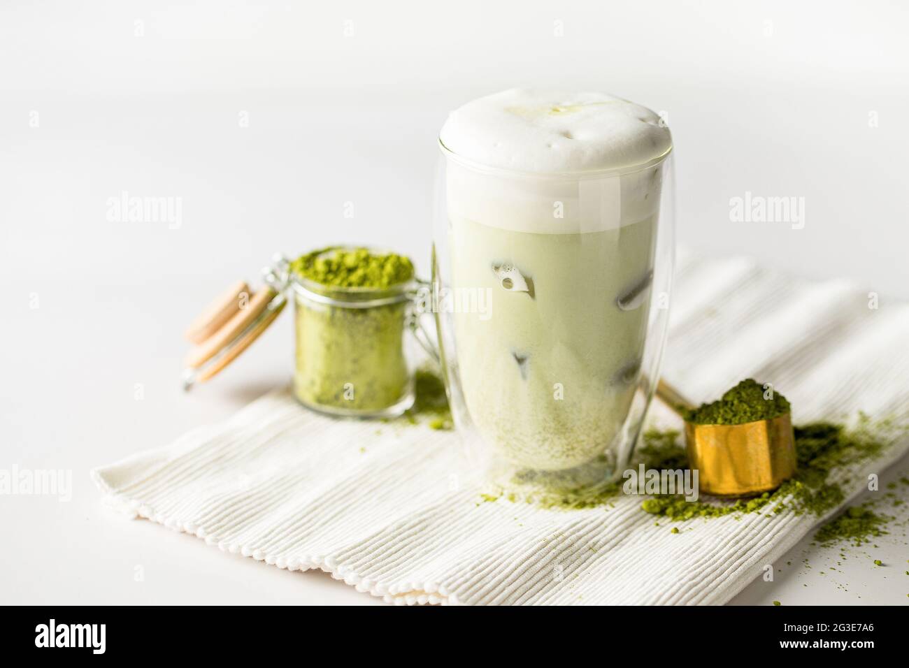 Glass of matcha green tea with ice cubes Stock Photo