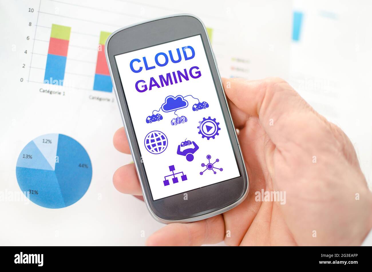 Cloud gaming concept on a smartphone held by a hand Stock Photo - Alamy