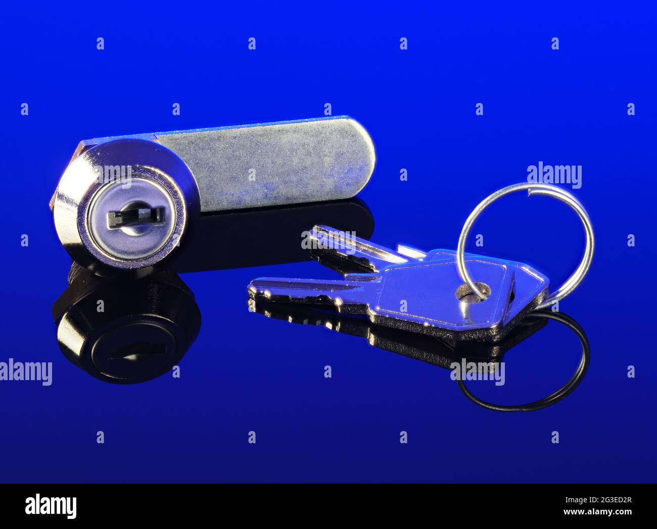 Letterbox locking cylinder and keys on dark blue backbround Stock Photo