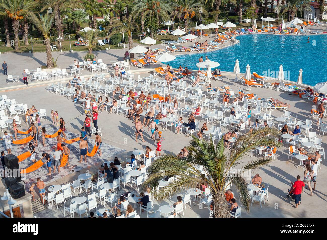 Antalya, Turkey-October 18, 2013: Tourists watching animation show in hotel in a summer afternoon. Stock Photo
