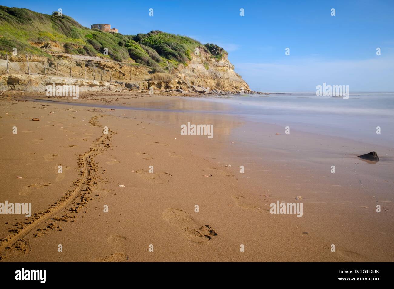 Lavinio sand beach with  Tor Caldara natural reserve with ancient tower on background, Anzio, Rome, Italy Stock Photo