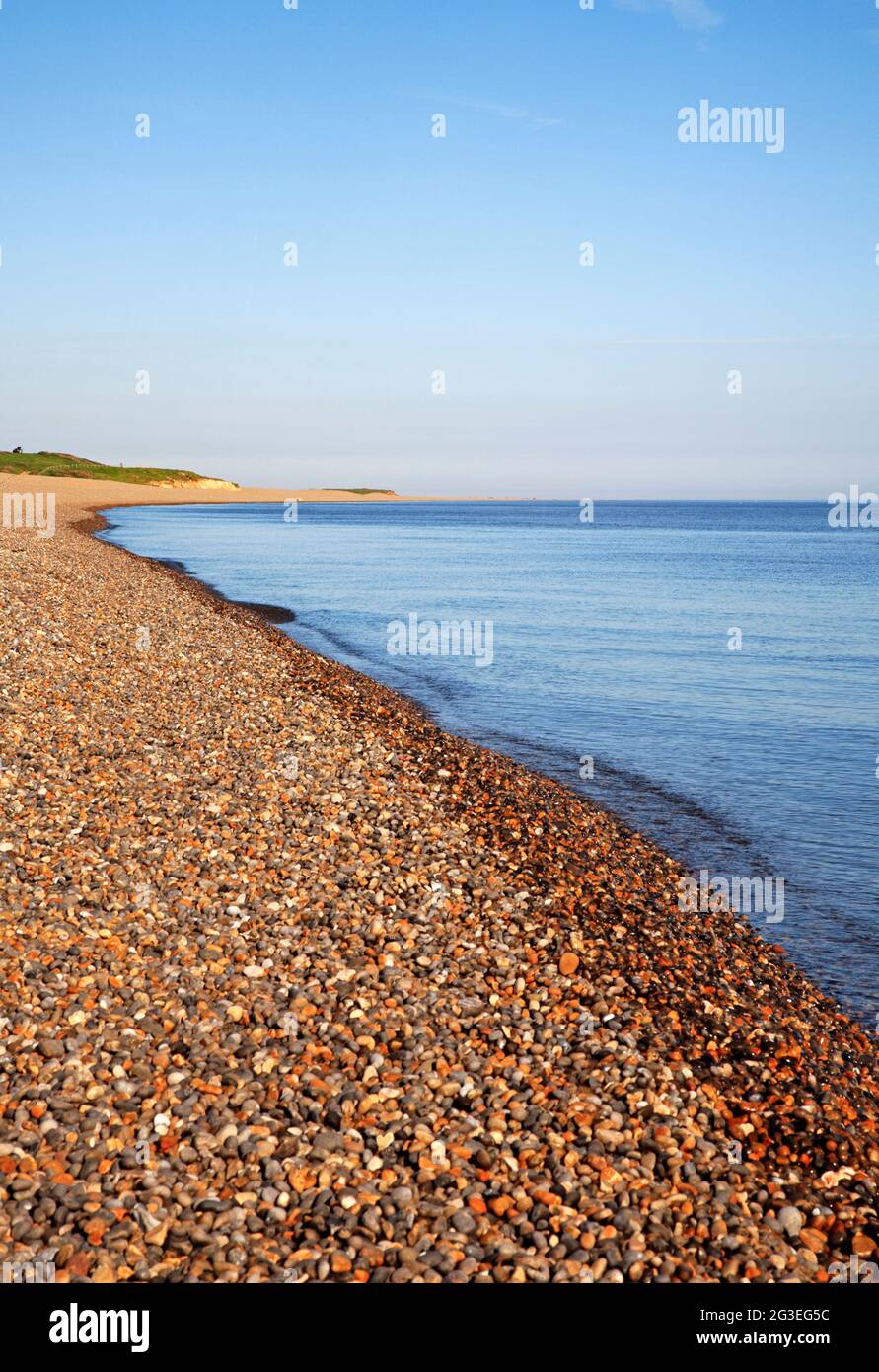A view of the shoreline receding westwards in an Area of Outstanding Natural Beauty in North Norfolk at Weybourne, Norfolk, England, United Kingdom. Stock Photo