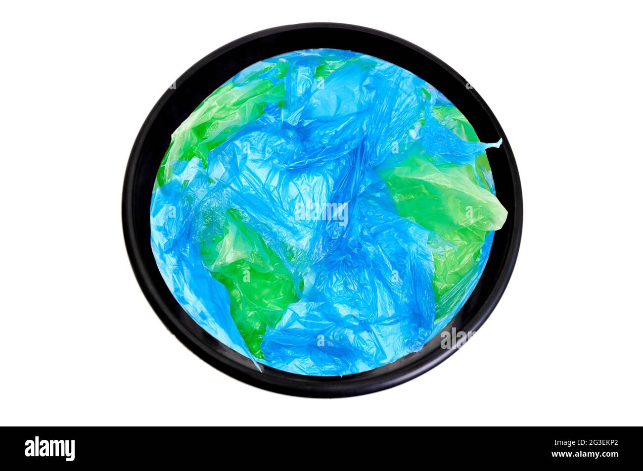 Earth globe made from plastic bags in a waste bin isolated on white. Planet care concept. Stock Photo